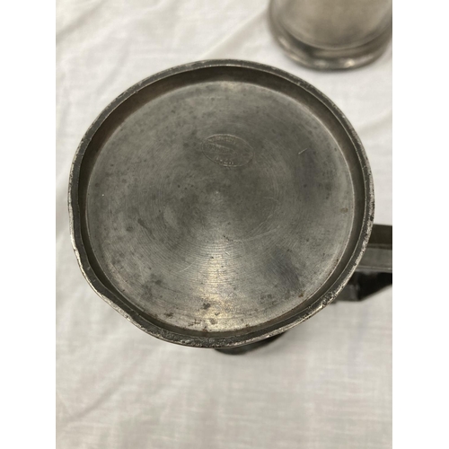 10 - A SET OF FIVE PEWTER GRADUATING MEASURING LIDDED JUGS MEASURING FROM LITRE TO DEMI-DECILITRE WITH TO... 