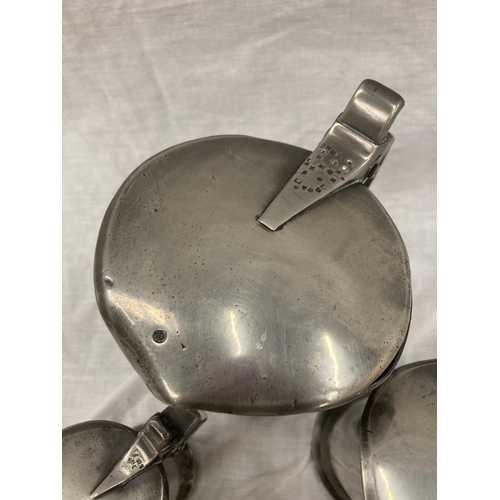 10 - A SET OF FIVE PEWTER GRADUATING MEASURING LIDDED JUGS MEASURING FROM LITRE TO DEMI-DECILITRE WITH TO... 