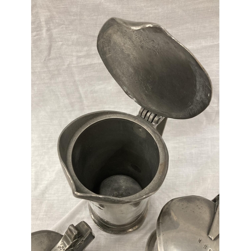 10 - A SET OF FIVE PEWTER GRADUATING MEASURING LIDDED JUGS MEASURING FROM LITRE TO DEMI-DECILITRE WITH TO... 