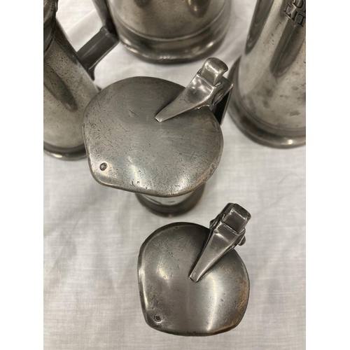 10 - A SET OF FIVE PEWTER GRADUATING MEASURING LIDDED JUGS MEASURING FROM LITRE TO DEMI-DECILITRE WITH TO... 
