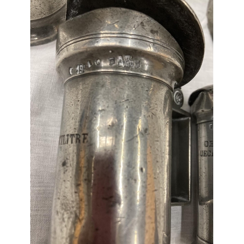 10 - A SET OF FIVE PEWTER GRADUATING MEASURING LIDDED JUGS MEASURING FROM LITRE TO DEMI-DECILITRE WITH TO... 