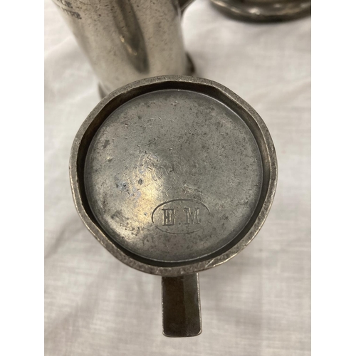 10 - A SET OF FIVE PEWTER GRADUATING MEASURING LIDDED JUGS MEASURING FROM LITRE TO DEMI-DECILITRE WITH TO... 