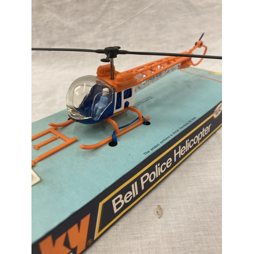 16 - A VINTAGE DINKY TOYS BELL POLICE HELICOPTER IN ORIGINAL BLISTER PACK AND A LINTOY PIPER NAVAJO IN OR... 