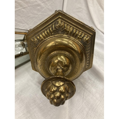 27 - A PAIR OF VINTAGE BRASS COACHING LAMPS - NOW CONVERTED TO ELECTRICITY, THE GLASS DECORATED WITH BRAS... 