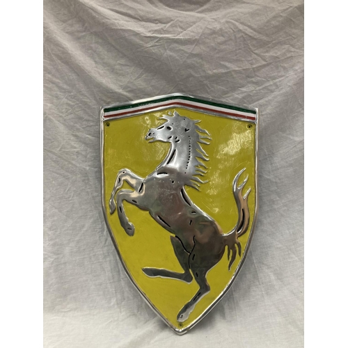 33 - A LARGE CHROME FERRARI SHIELD SHAPED SIGN 60CM X 41CM