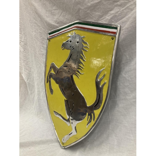 33 - A LARGE CHROME FERRARI SHIELD SHAPED SIGN 60CM X 41CM