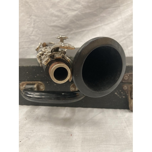 39 - A BOXED BOOSEY AND HAWKES CLARINET 77 BOEHM SYSTEM WITH SPARE REEDS AND 'PRACTICAL TUTOR FOR THE CLA... 