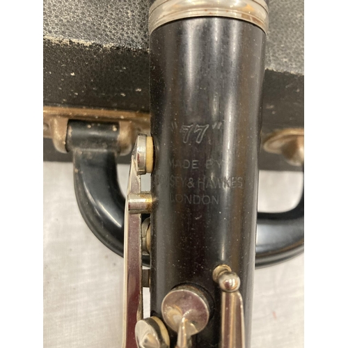 39 - A BOXED BOOSEY AND HAWKES CLARINET 77 BOEHM SYSTEM WITH SPARE REEDS AND 'PRACTICAL TUTOR FOR THE CLA... 