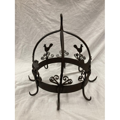 5 - A WROUGHT IRON HANGING UTENSIL HOLDER DECORATED WITH SCROLLS AND HENS HEIGHT 37CM, DIAMETER 30CM