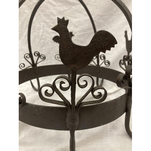 5 - A WROUGHT IRON HANGING UTENSIL HOLDER DECORATED WITH SCROLLS AND HENS HEIGHT 37CM, DIAMETER 30CM