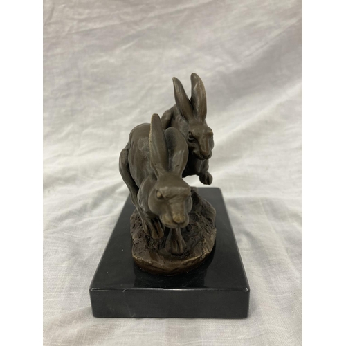 8 - A SIGNED BRONZE OF HARES RUNNING ON A MARBLE PLINTH HEIGHT 12CM, LENGTH 15CM