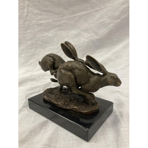 8 - A SIGNED BRONZE OF HARES RUNNING ON A MARBLE PLINTH HEIGHT 12CM, LENGTH 15CM