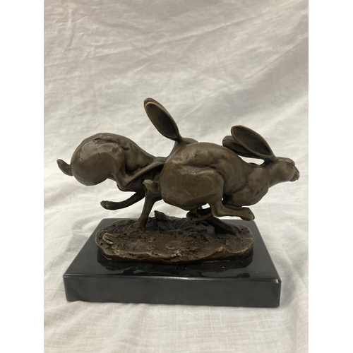 8 - A SIGNED BRONZE OF HARES RUNNING ON A MARBLE PLINTH HEIGHT 12CM, LENGTH 15CM