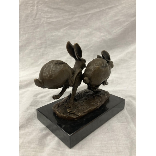 8 - A SIGNED BRONZE OF HARES RUNNING ON A MARBLE PLINTH HEIGHT 12CM, LENGTH 15CM