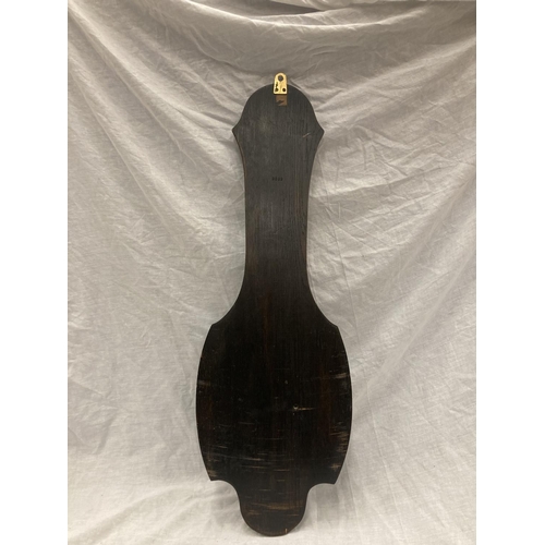 41 - A DARK OAK CASED VINTAGE CARVED BAROMETER - LENGTH APPROX 82CM