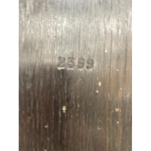 41 - A DARK OAK CASED VINTAGE CARVED BAROMETER - LENGTH APPROX 82CM