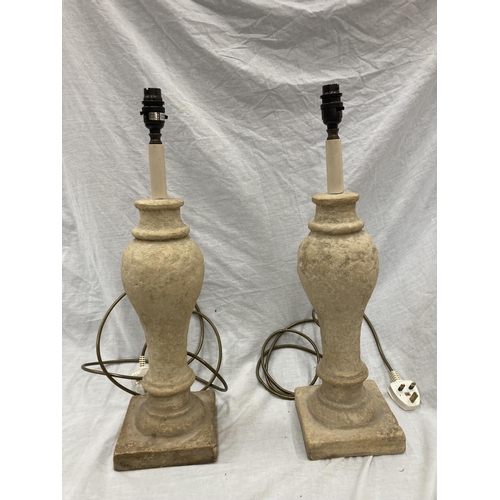 52 - A PAIR OF CREAM STONE LAMPS WITH SHADES - HEIGHT 54CM