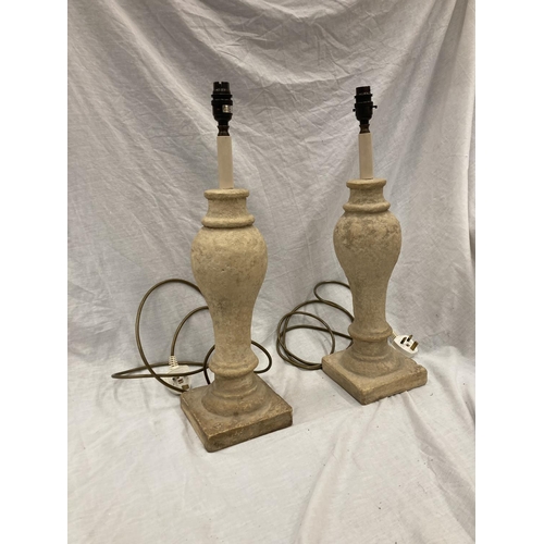52 - A PAIR OF CREAM STONE LAMPS WITH SHADES - HEIGHT 54CM