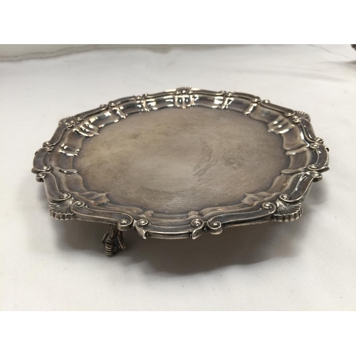 1 - A HALLMARKED BIRMINGHAM SILVER TRAY WITH PIE CRUST EDGE AND THREE BALL AND CLAW FEET GROSS WEIGHT 33... 