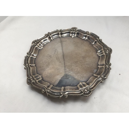 1 - A HALLMARKED BIRMINGHAM SILVER TRAY WITH PIE CRUST EDGE AND THREE BALL AND CLAW FEET GROSS WEIGHT 33... 