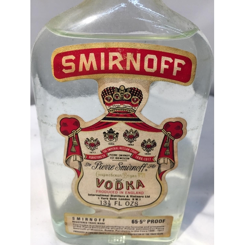 392 - A RARE BOTTLE OF SMIRNOFF 13 1/3 FL OZS AND 65.5 % PROOF PRODUCED IN ENGLAND TOGETHER WITH A 10CL HO... 