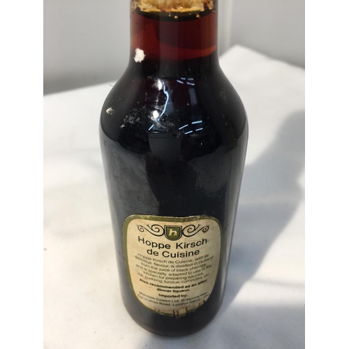 392 - A RARE BOTTLE OF SMIRNOFF 13 1/3 FL OZS AND 65.5 % PROOF PRODUCED IN ENGLAND TOGETHER WITH A 10CL HO... 