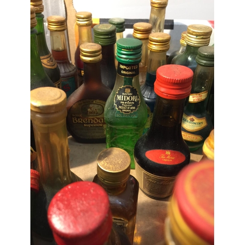 398 - A MIXTURE OF MINIATURES TO INCLUDE MAINLY LIQUER'S SUCH AS BLUE CURACA, CHERRY BRANDY, CAMPARI, DRAM... 