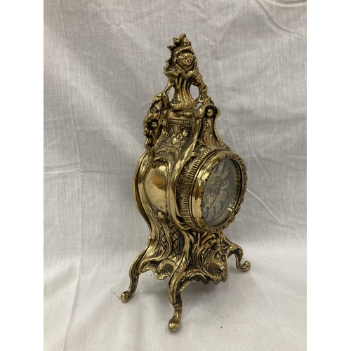 11 - A FRENCH ORNATE HEAVY BRASS MANTLE CLOCK WITH BATTERY MOVEMENT