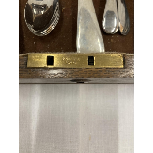 16 - AN OAK CASED FORTY SEVEN PIECE CANTEEN OF CUTLERY WITH BONE HANDLED KNIVES