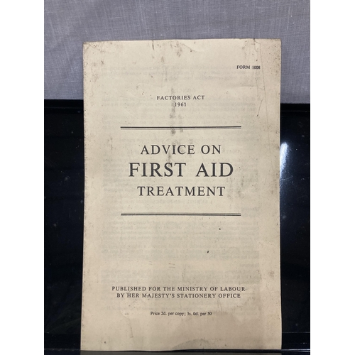 21 - A VINTAGE FIRST AID KIT IN A BLACK TIN WITH ORIGINAL CONTENTS