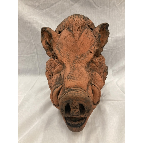 3 - A TERRACOTTA WALL MOUNTED BUST OF A WILD BOAR LENGTH 31 CM HEIGHT 30 CM