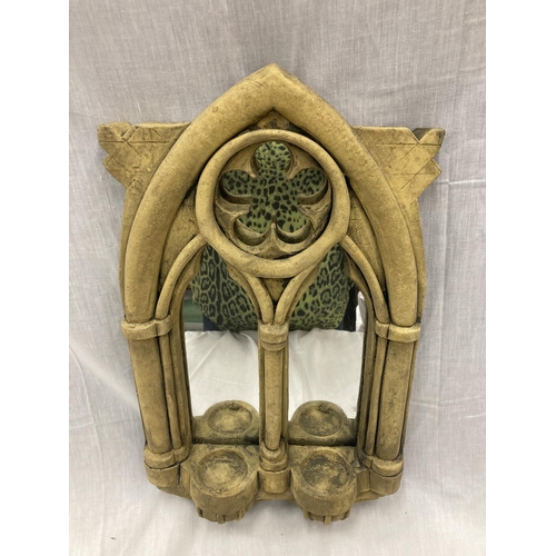 32 - A STONE FRAMED GOTHIC WINDOW STYLE MIRROR