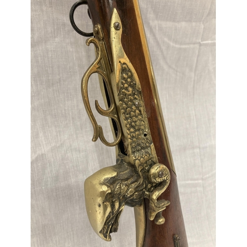 6 - A DECORATIVE ORNAMENTAL BRASS MUSKET