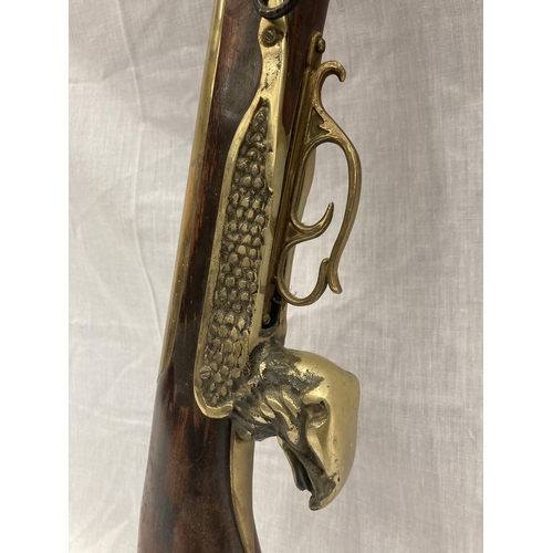 6 - A DECORATIVE ORNAMENTAL BRASS MUSKET