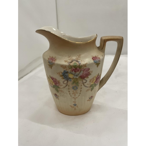 104 - A SET OF THREE CROWN DEVON 'QUEEN ANNE' GRADUATING BLUSH IVORY FLORAL JUGS