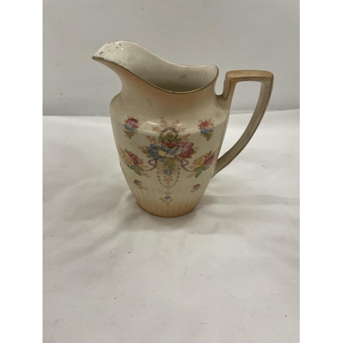 104 - A SET OF THREE CROWN DEVON 'QUEEN ANNE' GRADUATING BLUSH IVORY FLORAL JUGS