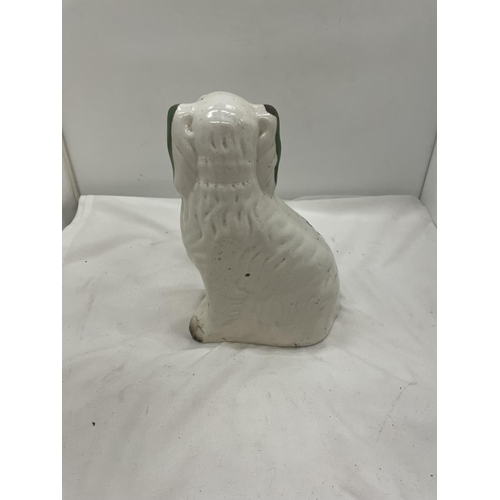 107 - A PAIR OF GREEN AND WHITE STAFFORDSHIRE DOGS HEIGHT 26CM