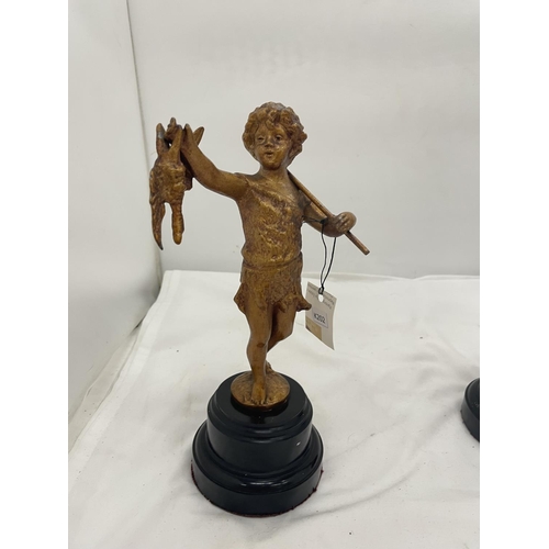 110 - TWO METAL FIGURES OF CLASSICAL CHILDREN ON WOODEN PLINTHS HEIGHT 28CM