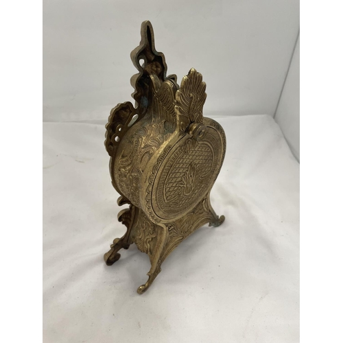 116 - AN ORNATELY DECORATED BRASS MANTLE CLOCK HEIGHT 28CM