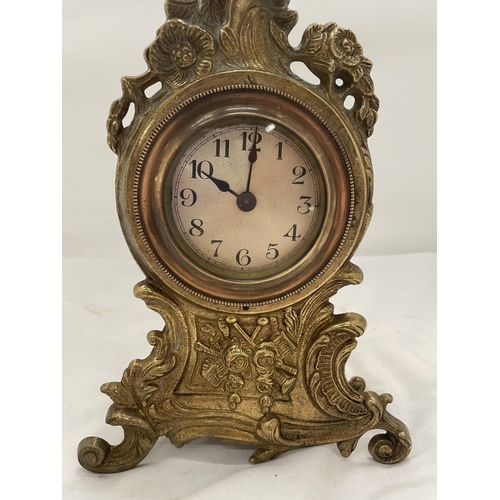 116 - AN ORNATELY DECORATED BRASS MANTLE CLOCK HEIGHT 28CM