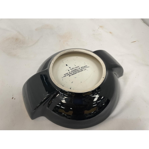 145 - A 1960'S GOLD AND BLACK 'GUINNESS' ASHTRAY