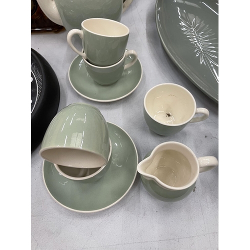 147 - A VINTAGE PALE GREEN AND CREAM VILLEROY AND BOCH PART TEA SET TO INCLUDE TEAPOT, CREAM JUG, CUPS AND... 