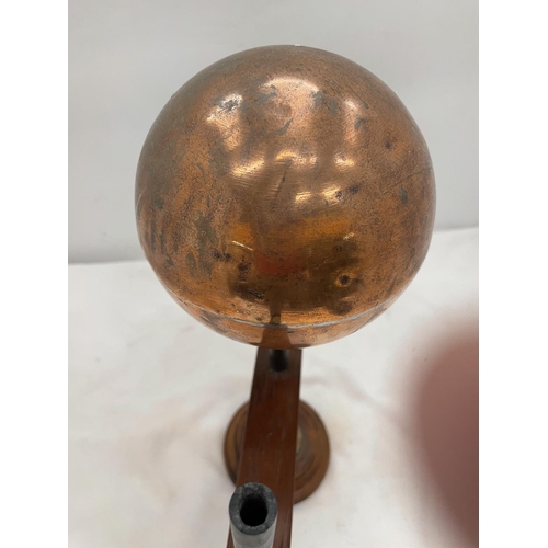 155 - A 'ART' PIECE OF A COPPER BALL ON A WOODEN STAND