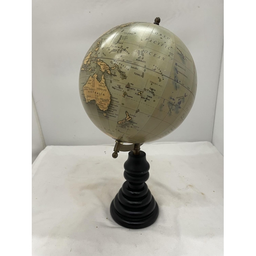 156 - A WORLD GLOBE ON A WOODEN STAND HEIGHT 40CM