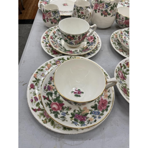 180 - A QUANTITY OF CROWN STAFFORDSHIRE FLORAL TEA WARE TO INCLUDE CUPS, SAUCERS, JUGS, PLATES AND SUGAR B... 