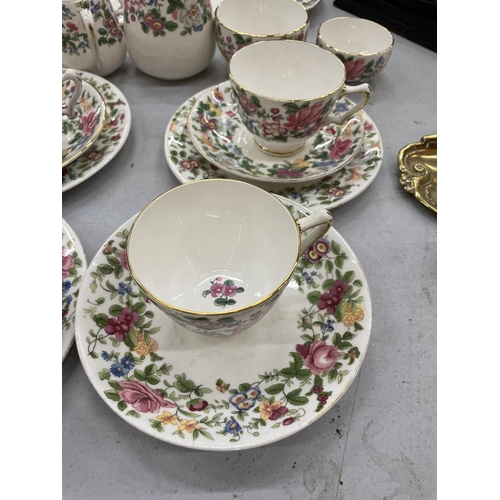 180 - A QUANTITY OF CROWN STAFFORDSHIRE FLORAL TEA WARE TO INCLUDE CUPS, SAUCERS, JUGS, PLATES AND SUGAR B... 