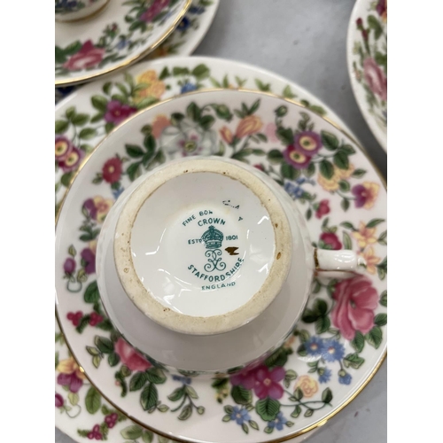 180 - A QUANTITY OF CROWN STAFFORDSHIRE FLORAL TEA WARE TO INCLUDE CUPS, SAUCERS, JUGS, PLATES AND SUGAR B... 