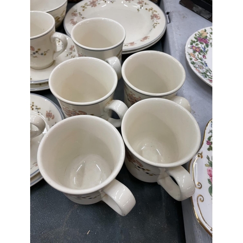 181 - A WICKER BASKET CONTAINING A QUANTITY OF STEELITE CUPS, SAUCERS, PLATES, ETC