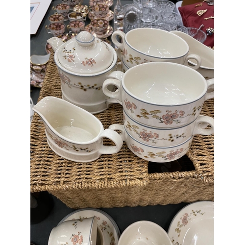 181 - A WICKER BASKET CONTAINING A QUANTITY OF STEELITE CUPS, SAUCERS, PLATES, ETC