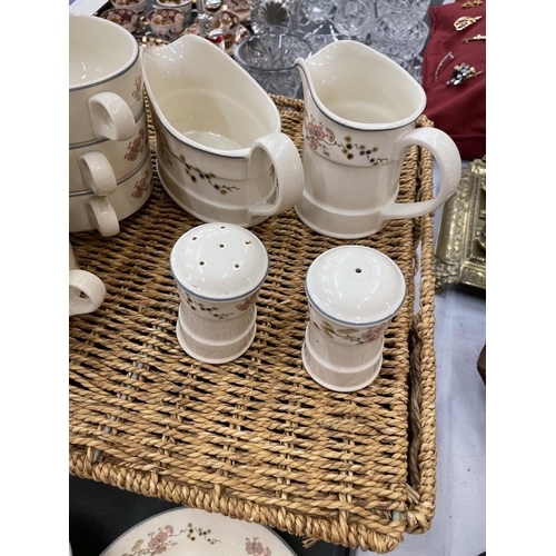 181 - A WICKER BASKET CONTAINING A QUANTITY OF STEELITE CUPS, SAUCERS, PLATES, ETC